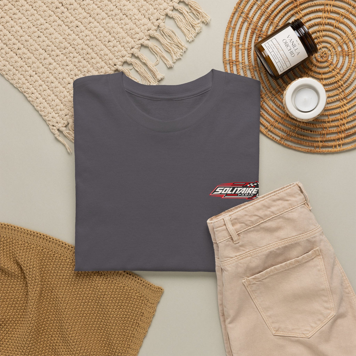 Charcoal grey minimalist t-shirt with Solitaire Paris logo on a flat lay background.